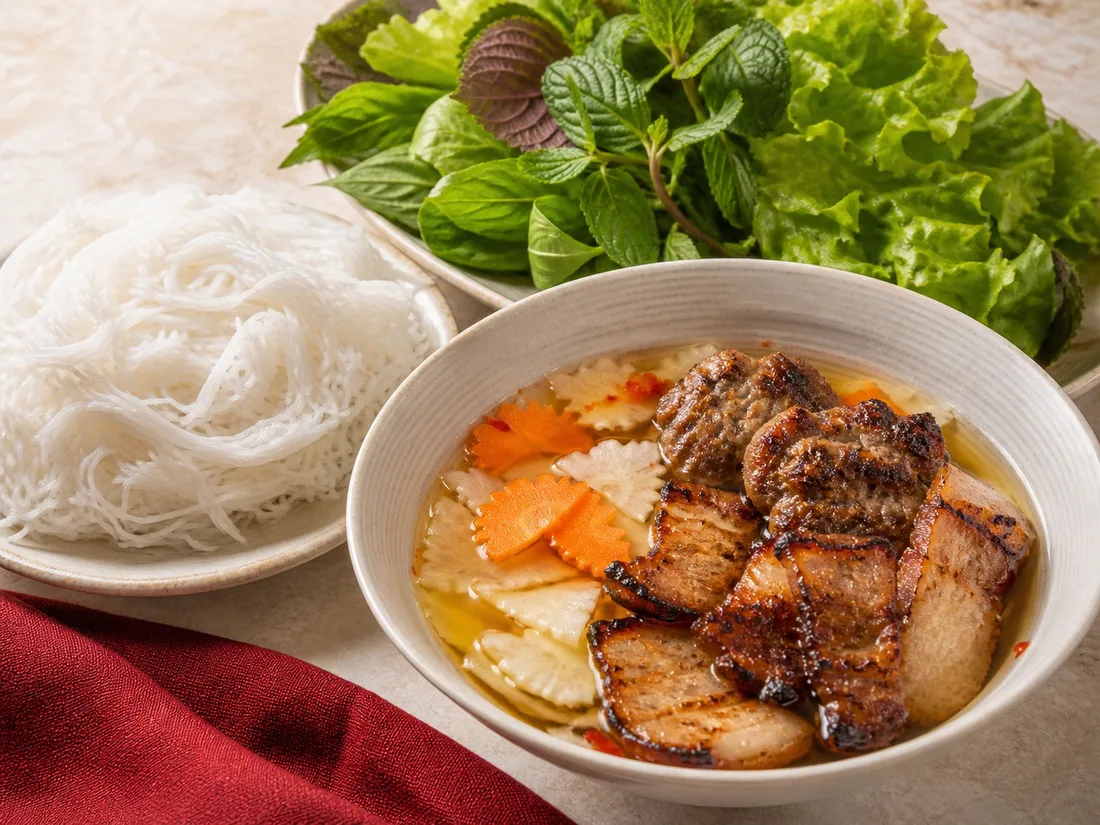 Hanoi grilled pork with vermicelli, herbs and dipping broth